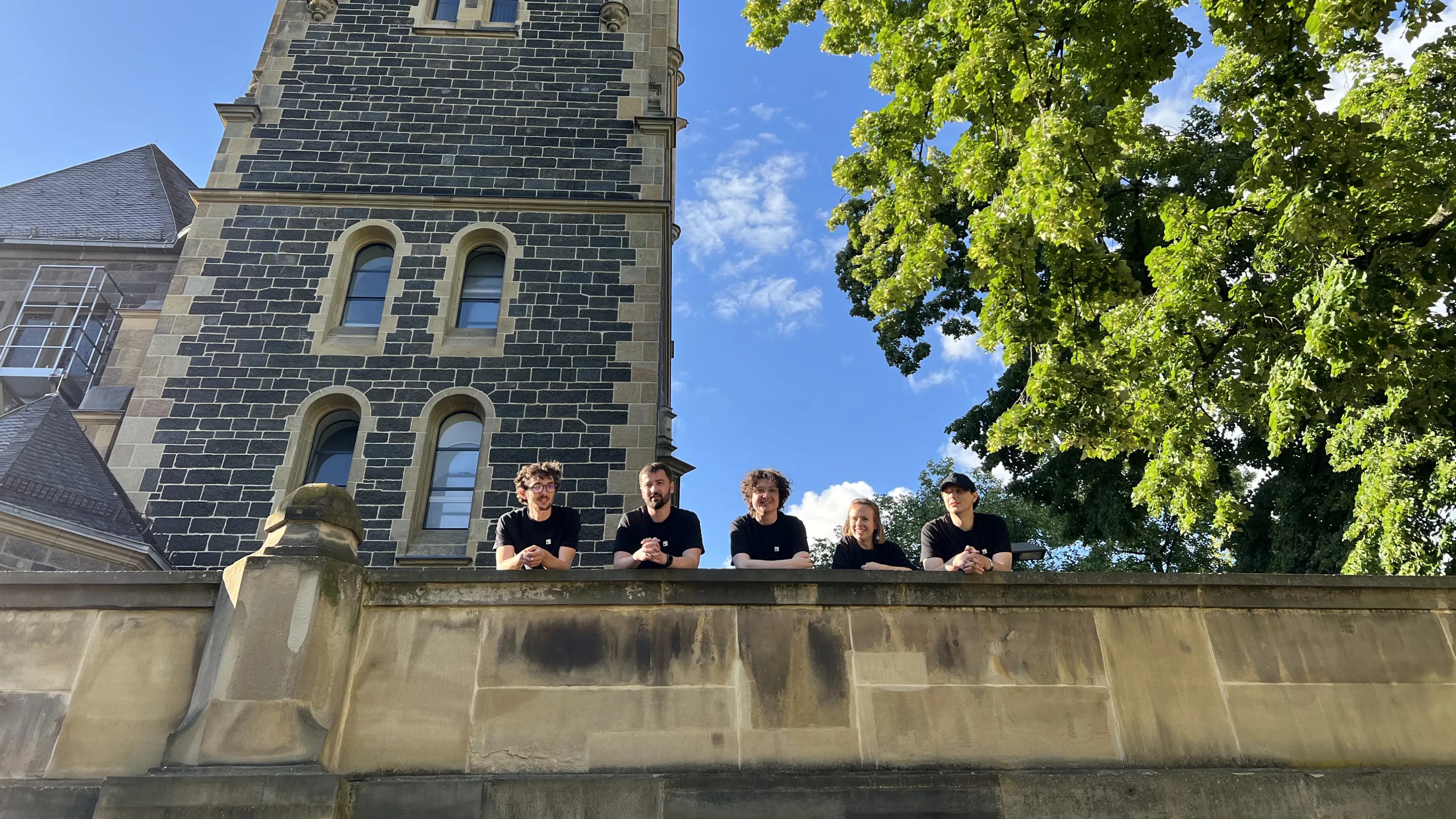 The Meteroid founding team gathered on a terrace